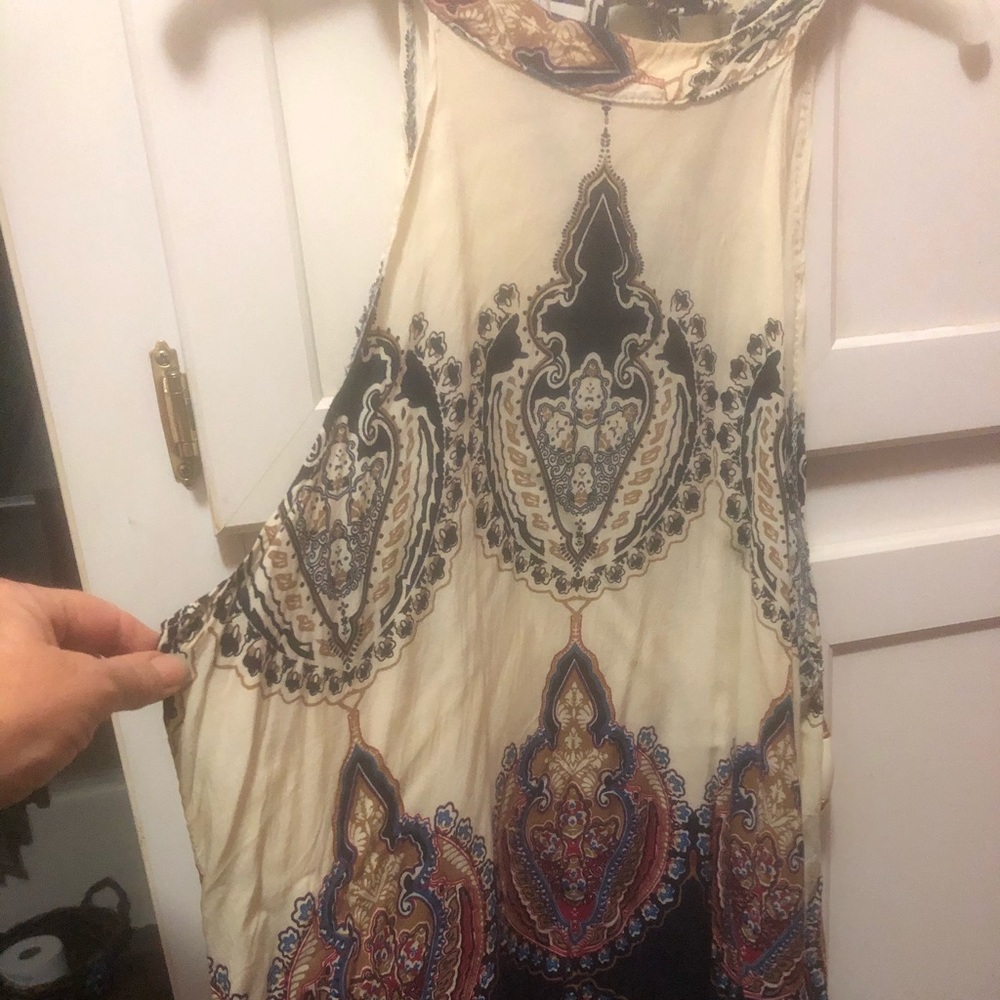 Halter like tunic. Very light and cool with tie